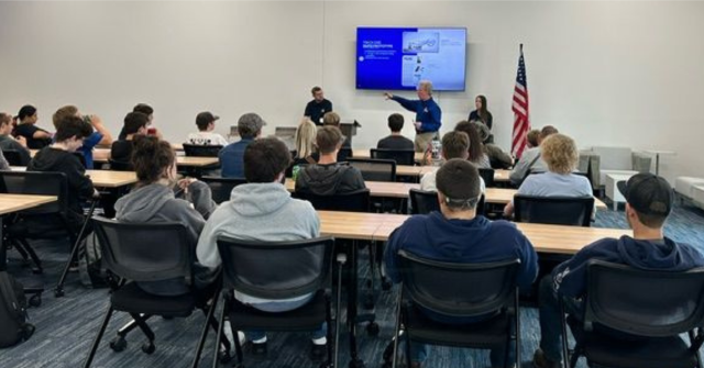 Students participate in a breakout discussion led by company founder Steve Hirsh and senior engineer Brian Clark
